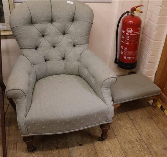 A Victorian armchair and associated footstool